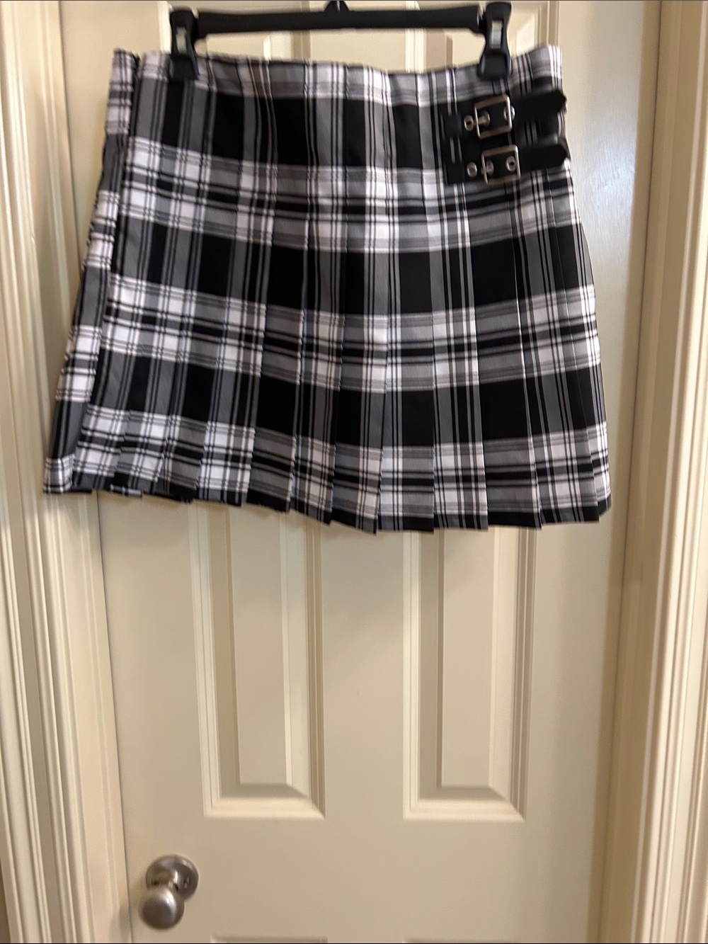 Juniors Black and White Plaid Pleated Mini Skirt with Buckle Detail